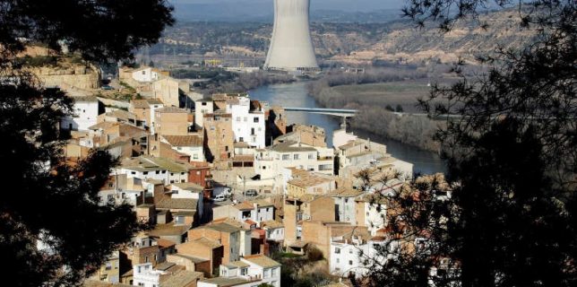 FILE PHOTO: A view of Asco village and a nuclear plant, which uses the waters of the Ebro river water to cool it, in Asco near Tarragona