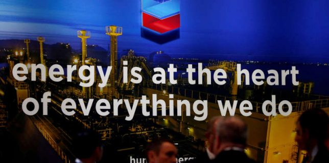 FILE PHOTO: The logo of Chevron Corp is seen in its booth at Gastech, the world’s biggest expo for the gas industry, in Chiba
