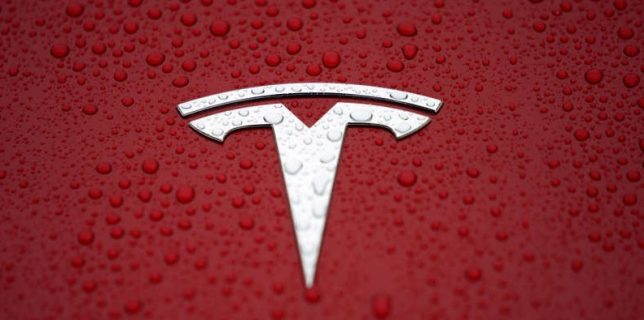 FILE PHOTO: FILE PHOTO: A Tesla logo is seen at a groundbreaking ceremony of Tesla Shanghai Gigafactory in Shanghai